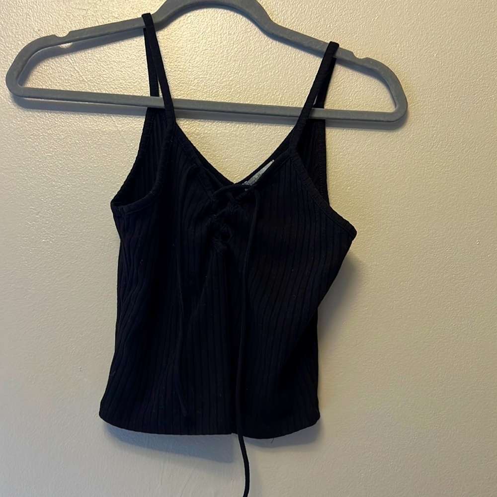 black cross tie in middle black tank top/ slightly cropped